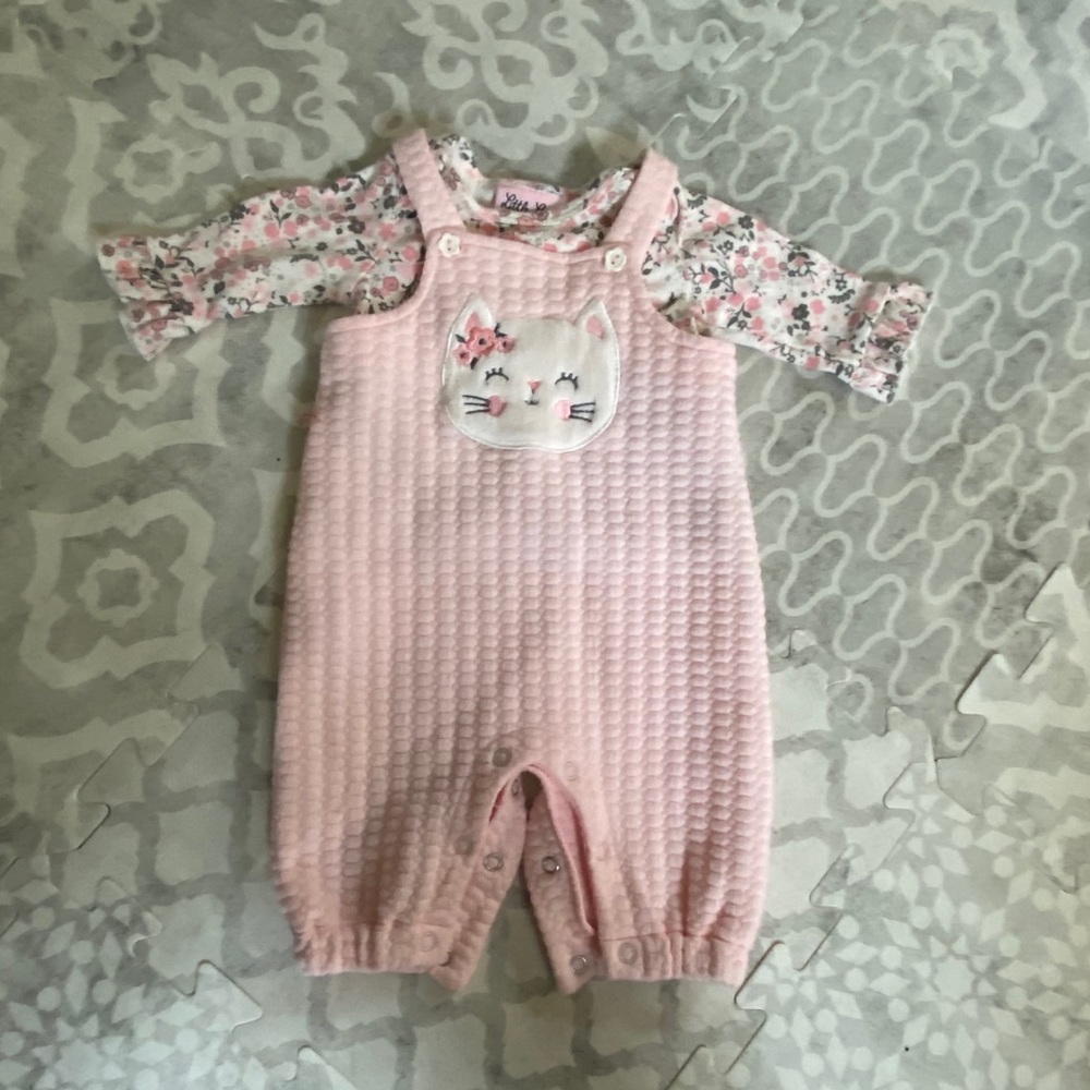 Pink overalls and floral shirt